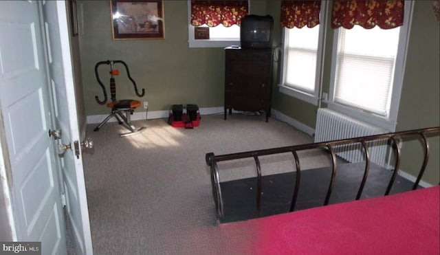 1620 Florence St, Williamsport, PA 17701 - exercise area featuring radiator heating unit, carpet flooring, and baseboards
