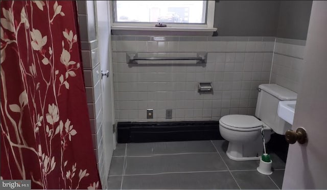 1620 Florence St, Williamsport, PA 17701 - bathroom with tile patterned floors, toilet, tile walls, and curtained shower