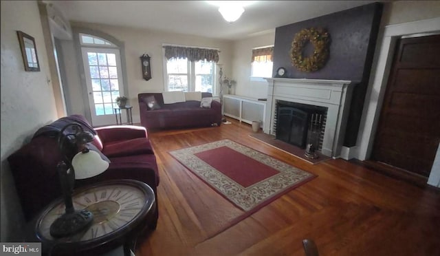 1620 Florence St, Williamsport, PA 17701 - living room featuring wood finished floors and a brick fireplace