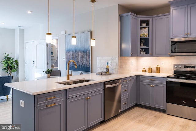 9981A Justify Run, Laurel, MD 20723 - kitchen with stainless steel appliances, a sink, gray cabinetry, a peninsula, and recessed lighting