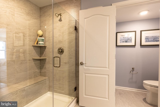 9981A Justify Run, Laurel, MD 20723 - bathroom featuring toilet, a shower stall, and baseboards