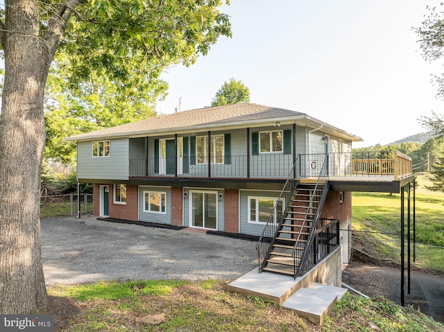 9708 Martinsburg Rd, Hedgesville, WV 25427 - back of house featuring stairs, brick siding, and a deck