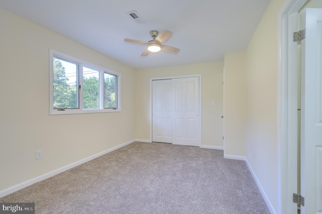 9708 Martinsburg Rd, Hedgesville, WV 25427 - unfurnished bedroom featuring carpet, a closet, baseboards, and a ceiling fan