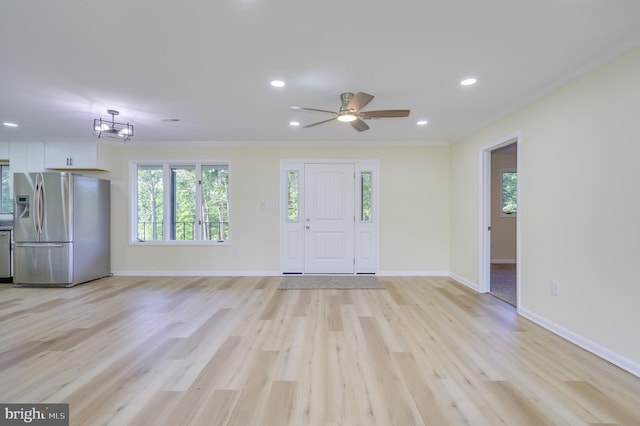 9708 Martinsburg Rd, Hedgesville, WV 25427 - unfurnished living room with recessed lighting, ornamental molding, light wood-type flooring, a ceiling fan, and baseboards