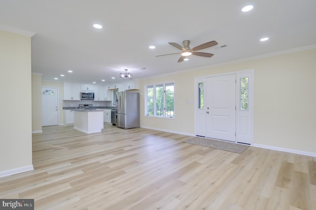 9708 Martinsburg Rd, Hedgesville, WV 25427 - unfurnished living room featuring ornamental molding, recessed lighting, baseboards, light wood-type flooring, and a ceiling fan