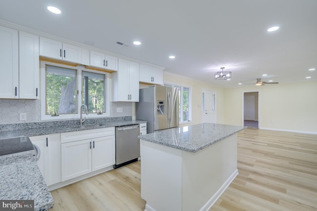 9708 Martinsburg Rd, Hedgesville, WV 25427 - kitchen featuring stainless steel appliances, light wood-type flooring, white cabinets, and recessed lighting