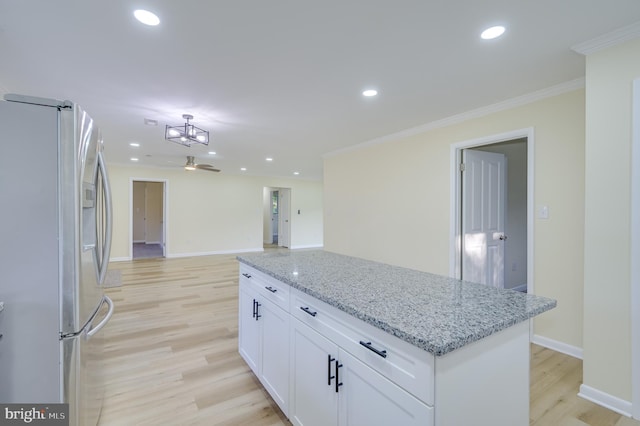 9708 Martinsburg Rd, Hedgesville, WV 25427 - kitchen with stainless steel fridge with ice dispenser, light wood-style flooring, crown molding, white cabinetry, and a kitchen island