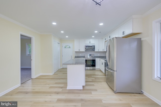 9708 Martinsburg Rd, Hedgesville, WV 25427 - kitchen featuring appliances with stainless steel finishes, white cabinets, recessed lighting, a kitchen island, and crown molding