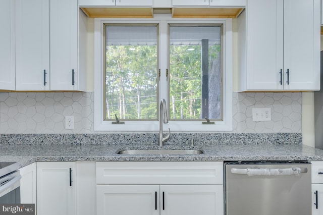 9708 Martinsburg Rd, Hedgesville, WV 25427 - kitchen featuring stainless steel dishwasher, a sink, tasteful backsplash, white cabinetry, and light stone counters