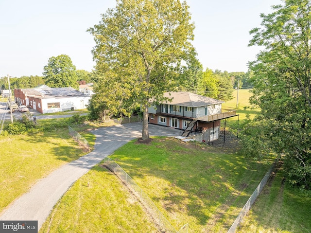 9708 Martinsburg Rd, Hedgesville, WV 25427 - back of property featuring asphalt driveway, a deck, and a yard