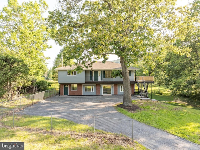 9708 Martinsburg Rd, Hedgesville, WV 25427 - multi unit property featuring stairway, brick siding, asphalt driveway, and a deck