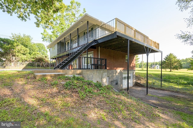 9708 Martinsburg Rd, Hedgesville, WV 25427 - back of property with stairs, a deck, and brick siding