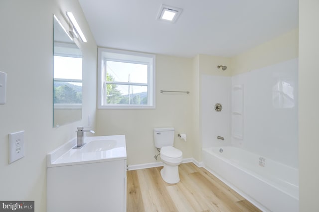 9708 Martinsburg Rd, Hedgesville, WV 25427 - full bathroom featuring toilet, wood finished floors, vanity, washtub / shower combination, and baseboards