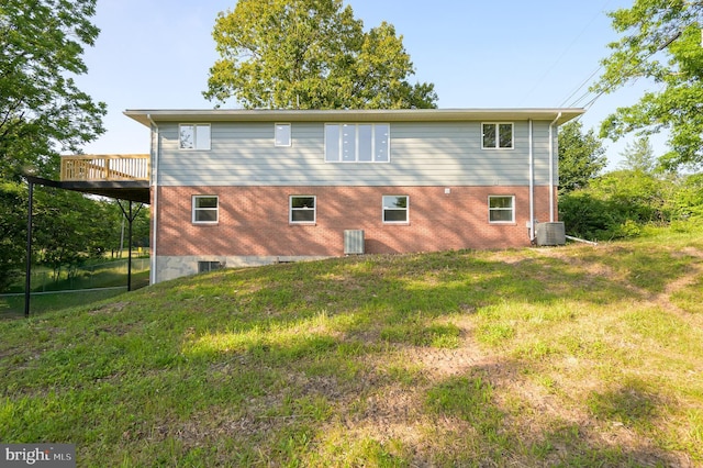 9708 Martinsburg Rd, Hedgesville, WV 25427 - rear view of house featuring central air condition unit, brick siding, and a deck