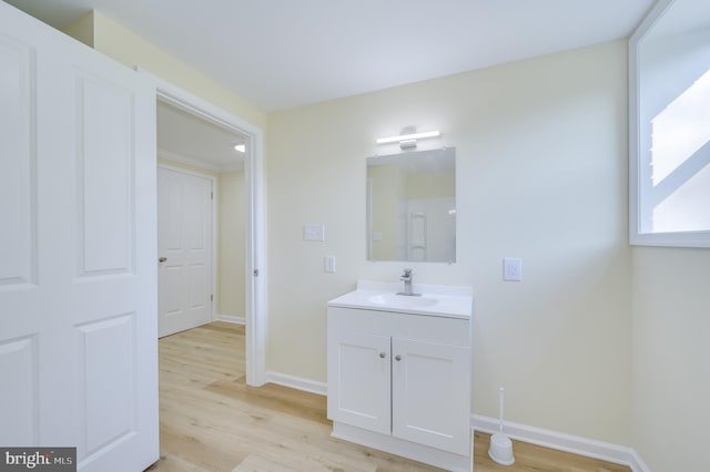 9708 Martinsburg Rd, Hedgesville, WV 25427 - bathroom featuring vanity, wood finished floors, and baseboards