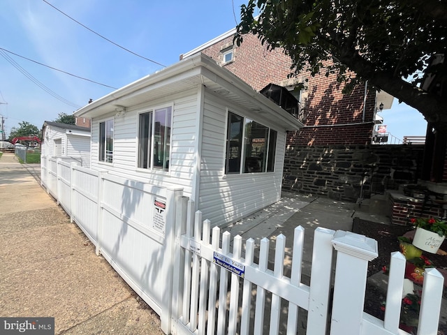 3438 Decatur St, Philadelphia, PA 19136 - view of side of property featuring a fenced front yard and brick siding