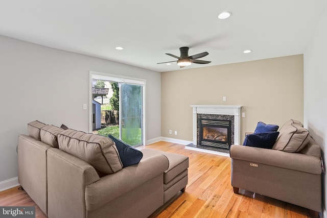 9416 Seven Courts Dr, Baltimore, MD 21236 - living room with a premium fireplace, recessed lighting, light wood-type flooring, baseboards, and a ceiling fan