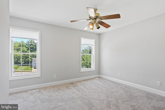 9416 Seven Courts Dr, Baltimore, MD 21236 - unfurnished room with plenty of natural light, baseboards, ceiling fan, and carpet floors