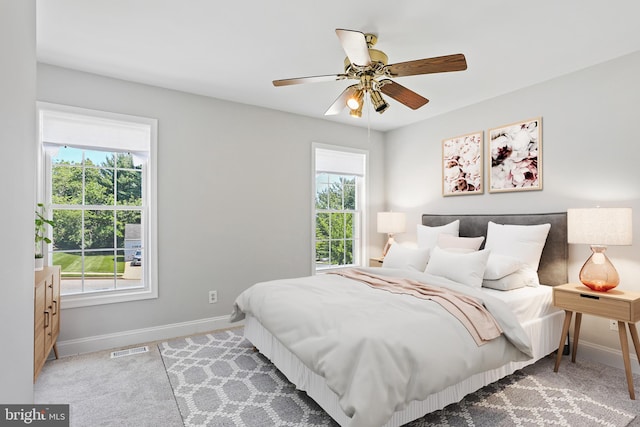 9416 Seven Courts Dr, Baltimore, MD 21236 - bedroom with baseboards, ceiling fan, and light carpet