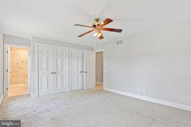 9416 Seven Courts Dr, Baltimore, MD 21236 - unfurnished bedroom with two closets, baseboards, carpet, connected bathroom, and a ceiling fan