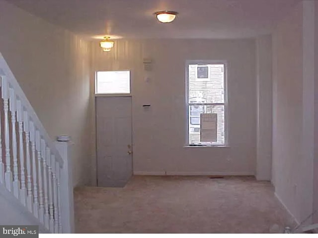 420 N Glover St, Baltimore, MD 21224 - carpeted entrance foyer with baseboards and stairs