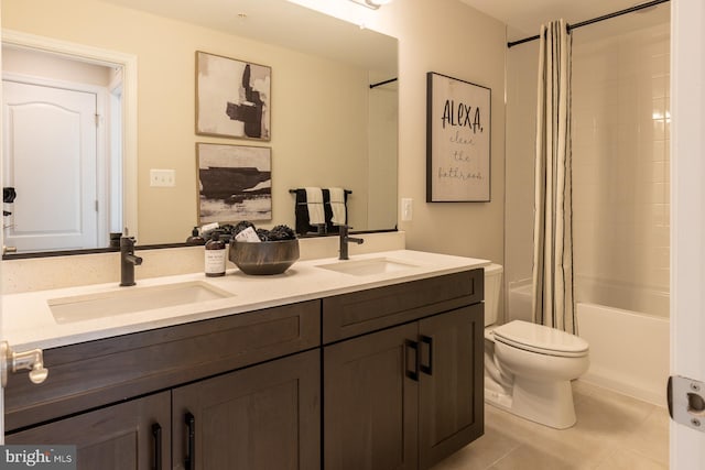 10009B American Pharoah Ln, Laurel, MD 20723 - full bath with double vanity, shower / bath combo, toilet, and tile patterned floors