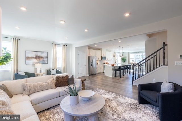 10009B American Pharoah Ln, Laurel, MD 20723 - living area with wood finished floors, recessed lighting, and stairway