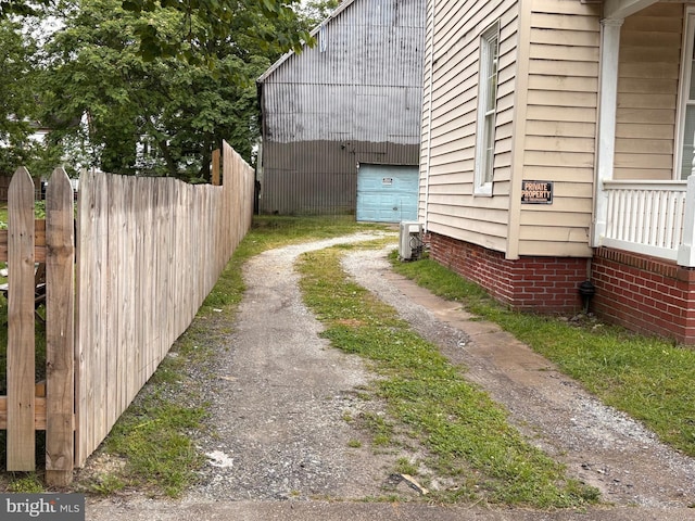 810 Locust St, Cambridge, MD 21613 - view of home's exterior with dirt driveway