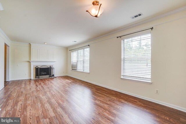 8064 Stonewall Brigade Ct, Manassas, VA 20109 - unfurnished living room featuring light wood-type flooring, baseboards, a fireplace, and ornamental molding