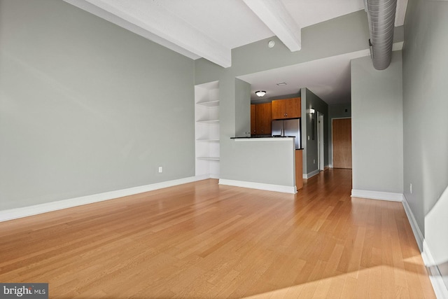 1100 S Broad St Unit 404C & # 212P, Philadelphia, PA 19146 - unfurnished living room with light wood-type flooring and built in features