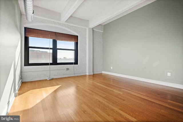 1100 S Broad St Unit 404C & # 212P, Philadelphia, PA 19146 - spare room with wood finished floors and beam ceiling