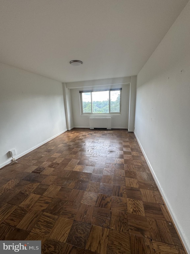4201 Cathedral Ave NW Unit 1209W, Washington, DC 20016 - spare room featuring radiator and baseboards