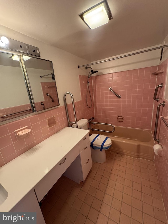 4201 Cathedral Ave NW Unit 1209W, Washington, DC 20016 - full bath with tile patterned flooring, tile walls, toilet, shower / bath combination, and vanity