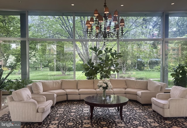 4201 Cathedral Ave NW Unit 1209W, Washington, DC 20016 - sunroom featuring a chandelier, plenty of natural light, and view of scattered trees