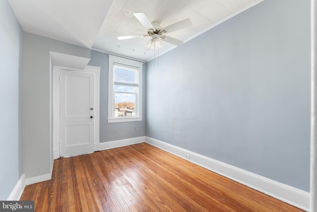 2808 Presstman St, Baltimore, MD 21216 - unfurnished room featuring baseboards, wood-type flooring, and a ceiling fan