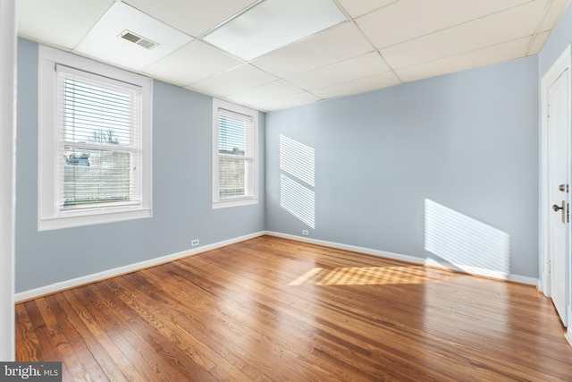 2808 Presstman St, Baltimore, MD 21216 - spare room featuring baseboards, wood finished floors, and a drop ceiling