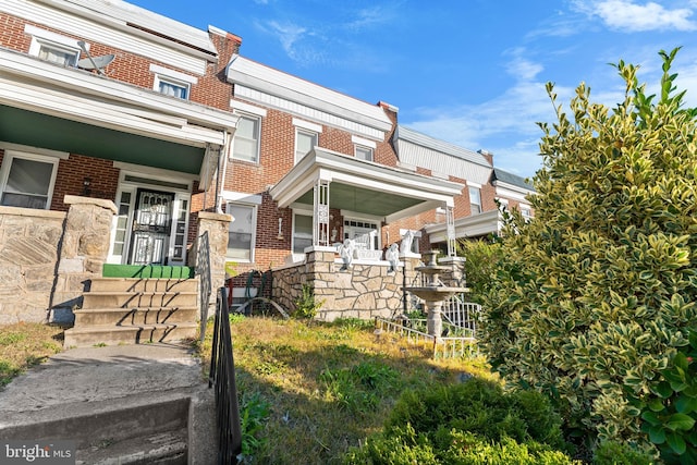 2808 Presstman St, Baltimore, MD 21216 - view of side of property featuring brick siding and a porch