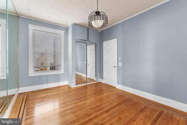 2808 Presstman St, Baltimore, MD 21216 - empty room featuring crown molding, wood-type flooring, and baseboards