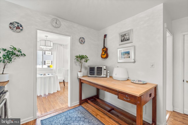206 Mountain Rd, Linthicum Heights, MD 21090 - interior space with wood finished floors, a chandelier, and baseboards