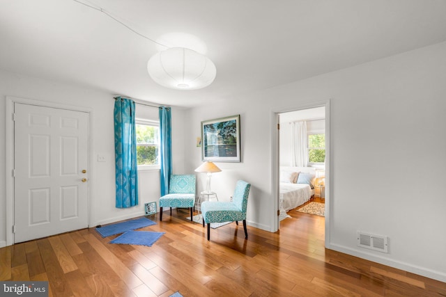 206 Mountain Rd, Linthicum Heights, MD 21090 - sitting room with plenty of natural light, wood finished floors, and baseboards
