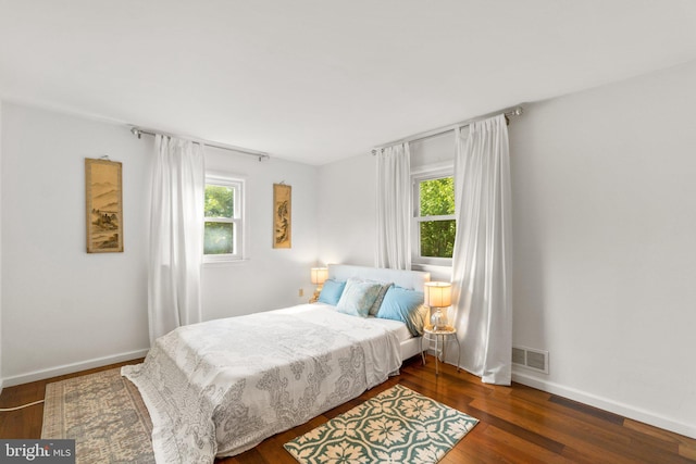 206 Mountain Rd, Linthicum Heights, MD 21090 - bedroom with multiple windows, wood finished floors, and baseboards
