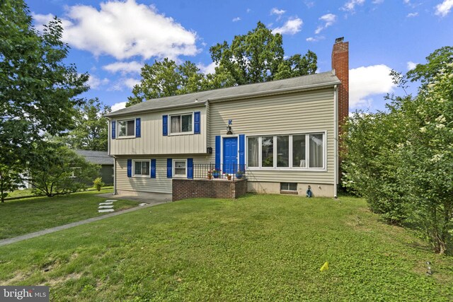 206 Mountain Rd, Linthicum Heights, MD 21090 - view of front of home with a chimney and a front lawn