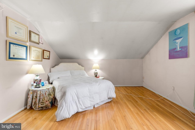 206 Mountain Rd, Linthicum Heights, MD 21090 - bedroom with lofted ceiling and wood finished floors