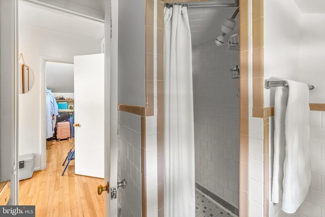206 Mountain Rd, Linthicum Heights, MD 21090 - bathroom with a stall shower, wood finished floors, and tile walls