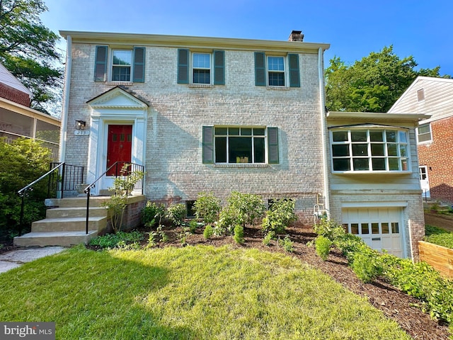 213 Dale Dr, Silver Spring, MD 20910 - colonial-style house with a chimney, brick siding, and an attached garage