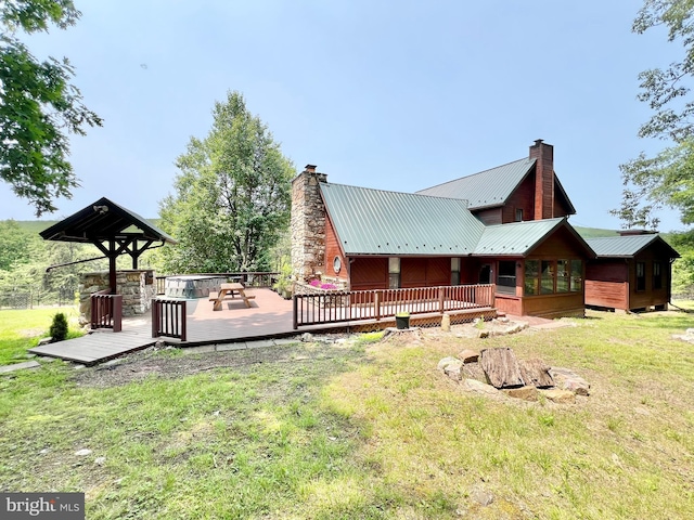 299 Valentine Acres Rd, Clearville, PA 15535 - back of property with a chimney, a deck, and a yard