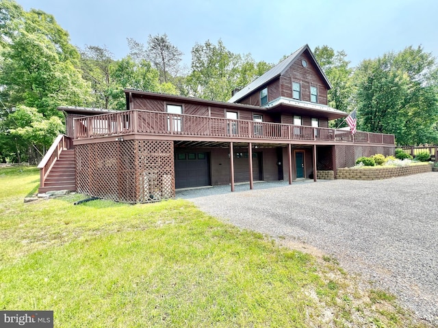 299 Valentine Acres Rd, Clearville, PA 15535 - view of front facade featuring gravel driveway, a deck, a garage, a front lawn, and stairs