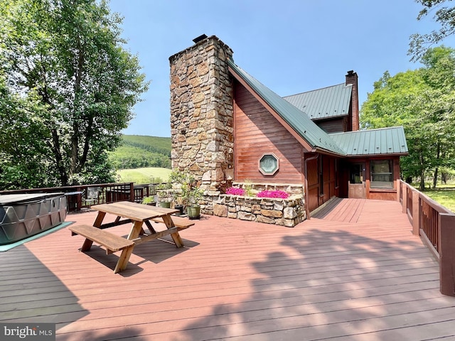 299 Valentine Acres Rd, Clearville, PA 15535 - wooden deck with a hot tub and outdoor dining space
