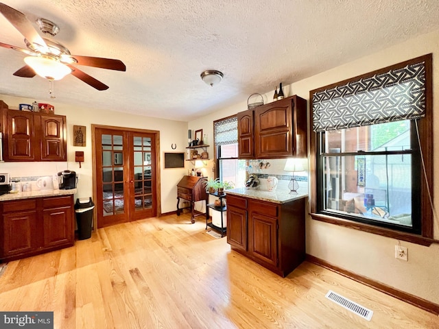 299 Valentine Acres Rd, Clearville, PA 15535 - kitchen with french doors, a textured ceiling, light wood-style flooring, healthy amount of natural light, and a ceiling fan