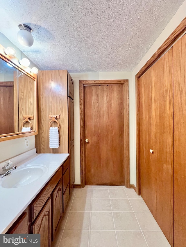 299 Valentine Acres Rd, Clearville, PA 15535 - bathroom with vanity, tile patterned flooring, and a textured ceiling